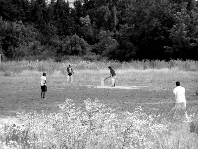 Baseball Players in Derelict Playing Field photo