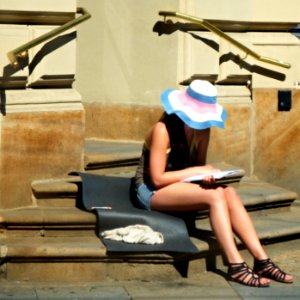 Girl Reading on the Stairs of Post Office photo