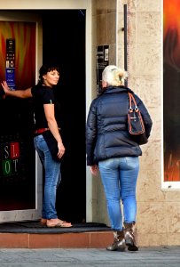 Woman Talking in front of Gambling Bar