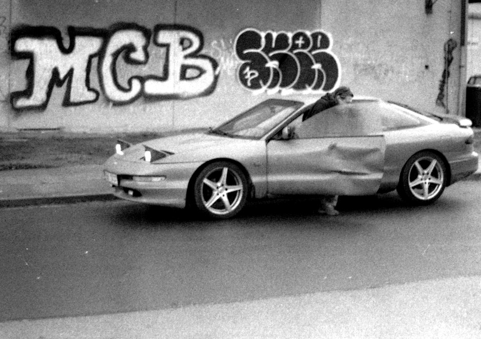 Praktica BC1 - Man Getting off his Car