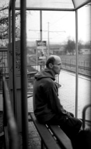 Praktica BC1 - Man Sitting at Tram Stop photo