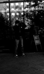 Kiev 4 + Helios 103 - Smiling Man on the Phone in front of the City Library 2