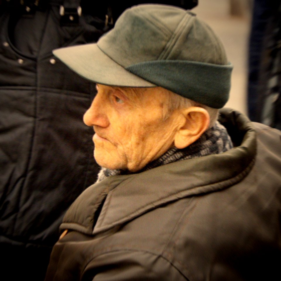 Old Man at Tram Stop Bench 3