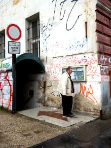 Elderly Man Surrounded by Graffitis