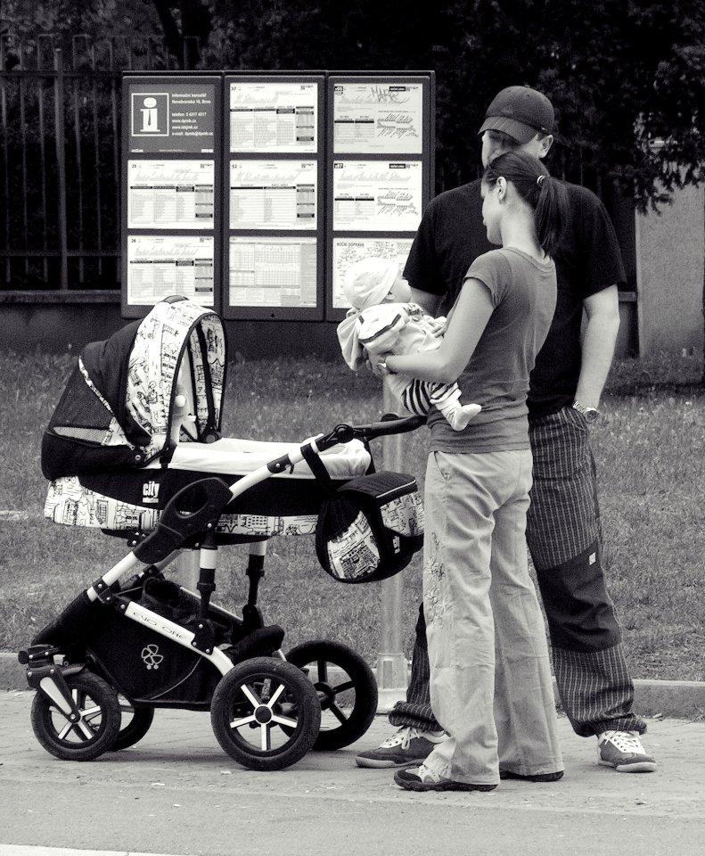 Young Family Waiting for the Bus