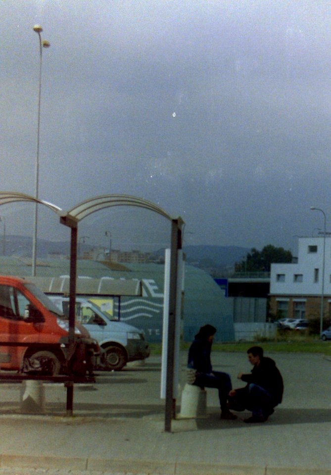 Praktica - Couple at Bus Stop