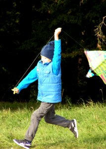 Little Boy Flying a Kite