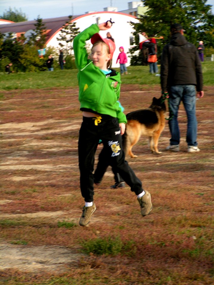 Girl in Green Flying the Kite 2