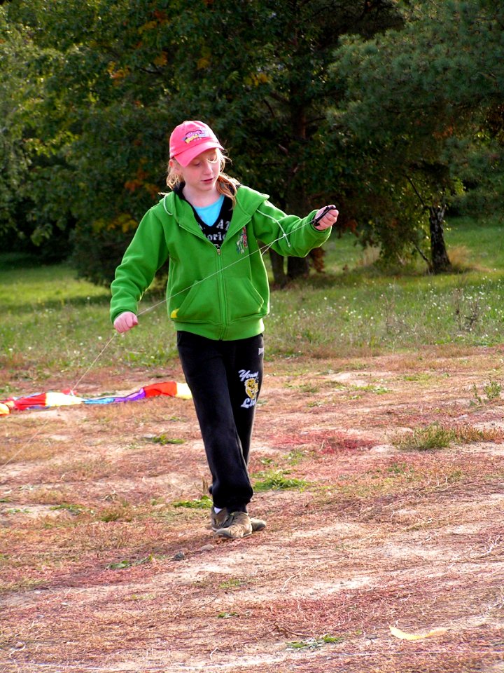 Girl in Green Flying the Kite 4