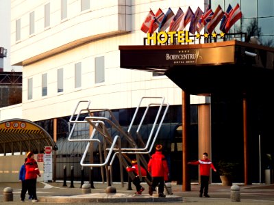 Boys Playing in front of a Hotel 1