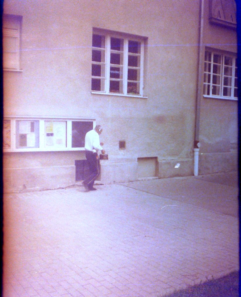 Chaika 3 (on redscale film) - Man on Sidewalk