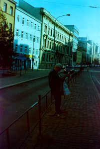 Smena 8M - Man Reading at Tram Stop