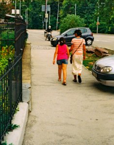 On Sidewalk 2 (redscale film)