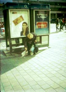 Chaika 3 - Woman Picking-up a Newspaper