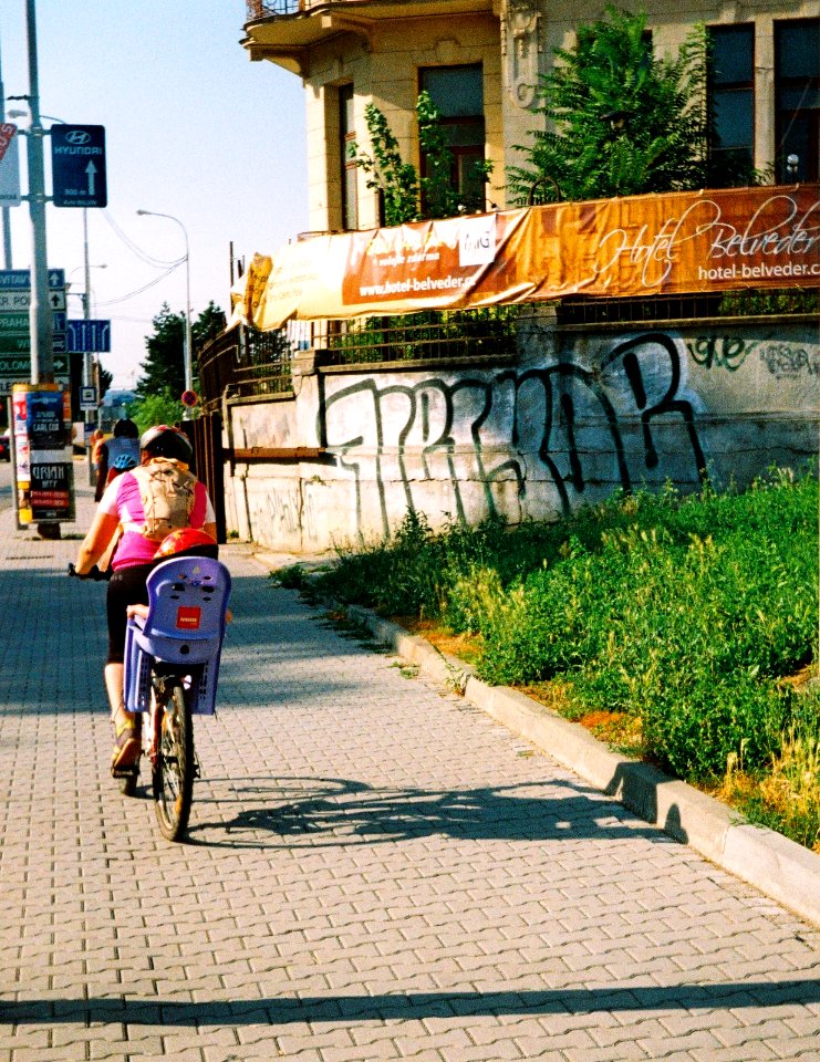 On Sidewalk 1 (redscale film)