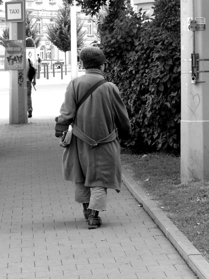 Lady in Heavy Coat in Summer