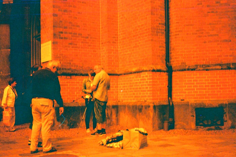 Pentacon Electra + redscale film - Photographer in front of the Red Church 2