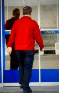 Man Entering a Supermarket