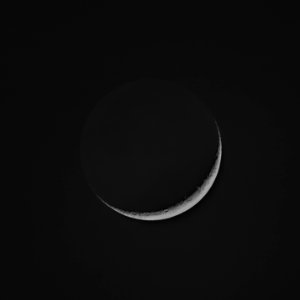 7% Illuminated Waxing Crescent Moon with Earthshine photo