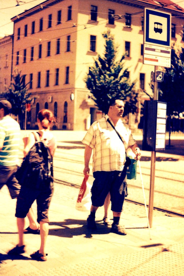 Praktica BC1 - Redscaled and Cross Processed - Blind man at Tram Stop