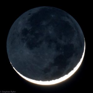 4% Illuminated Waxing Crescent Moon with Earthshine photo