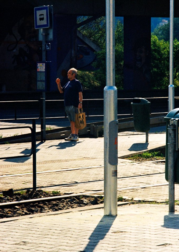 Kiev 4 + Jupiter-11 135/4 - Man at Tram Stop with Verticals