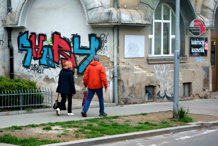Sony Alpha A230 with Helios-44-2 - Couple Passing by Graffiti