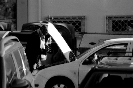 Praktica MTL 5 + Pentacon Electric 4/200 MC - Man Fixing His Car