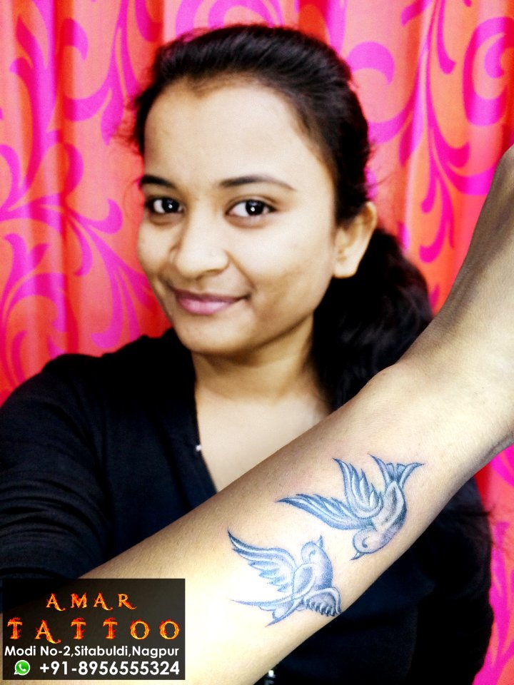 bird tattoo on wrist