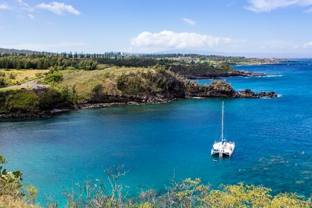 Sailing boat coastline water
