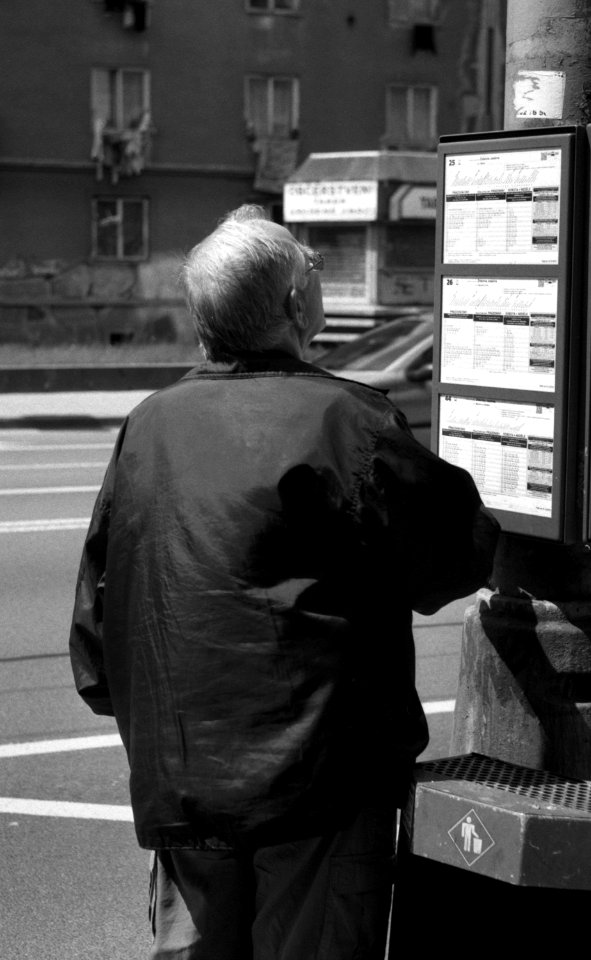 Praktica MTL 5 + Helios 44-2 2/58 - Man Looking at Schedule