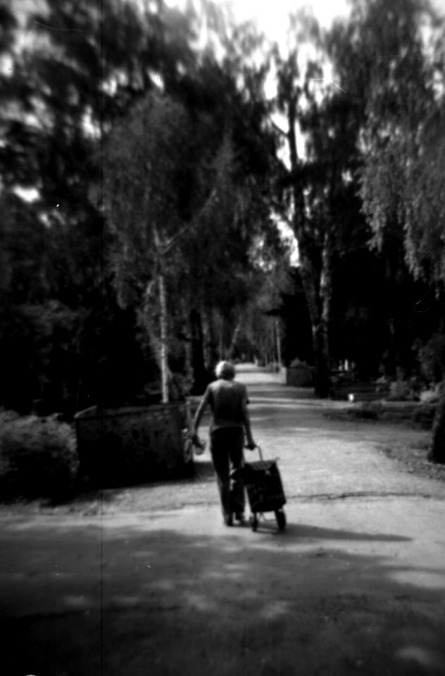 Holga 120FN - Old Woman on Cemetery Path