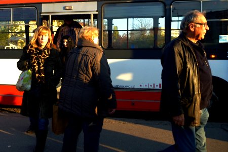 People Leaving a Bus