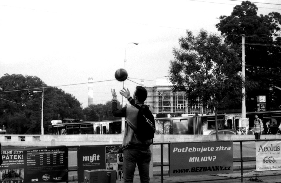 Olympus Mju II - Man Playing with a Ball at Tram Stop