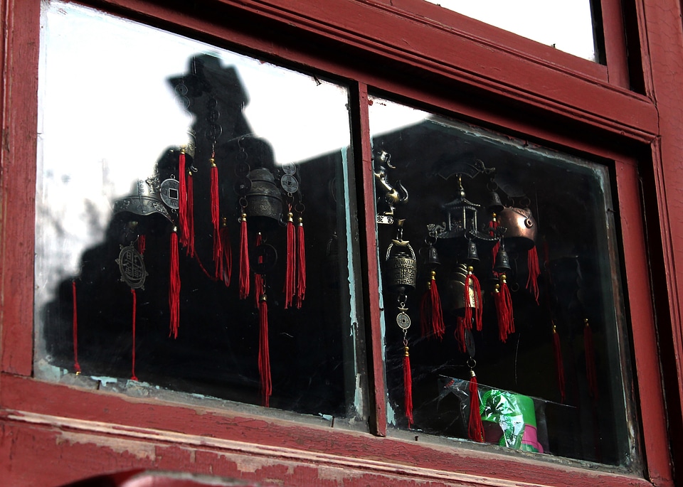 Brass bells red window