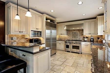 Upscale kitchen with breakfast bar photo