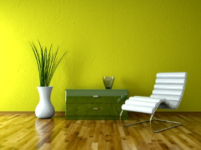 Wohndesign - Ledersessel vor grüner Wand photo