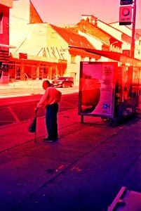 Pentacon Electra + Cross Processed Film - Man Waiting for a Tram photo