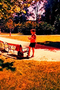 Pentacon Electra + Cross Processed Film - Woman at the Bench photo