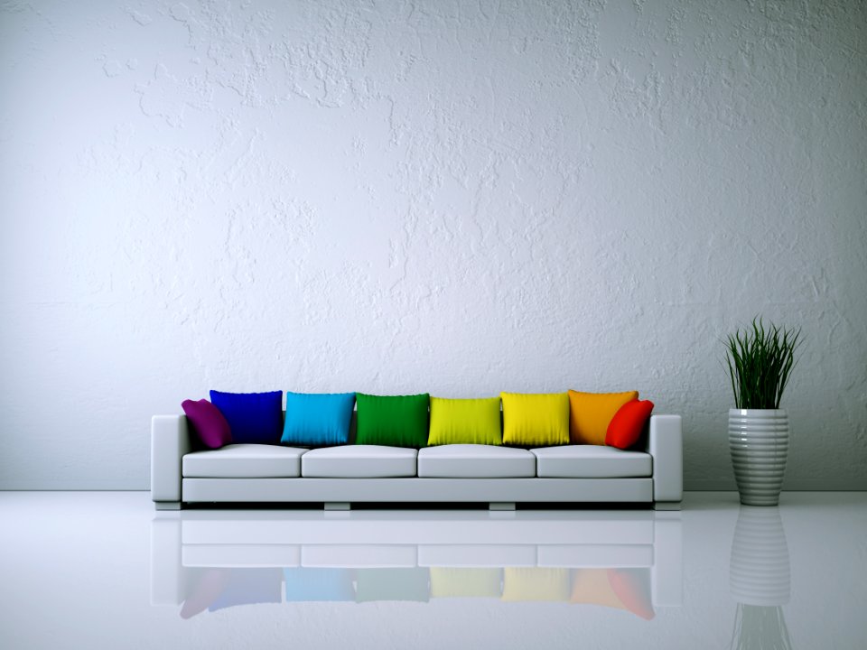 Weißes Sofa mit Kissen Regenbogenfarben