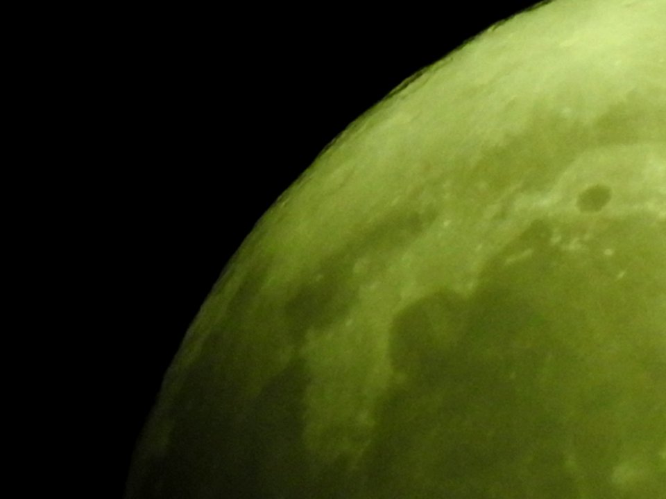 Blue moon, green moon, yellow moon. Tonight's full moon in Fort Collins, Colorado