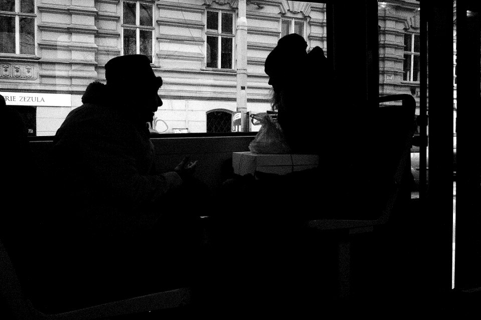 Old and Young Talking in the Tram