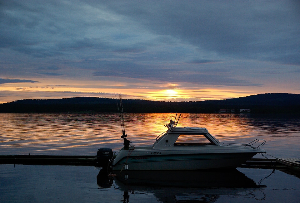 Lake fishing vessel midnight sun