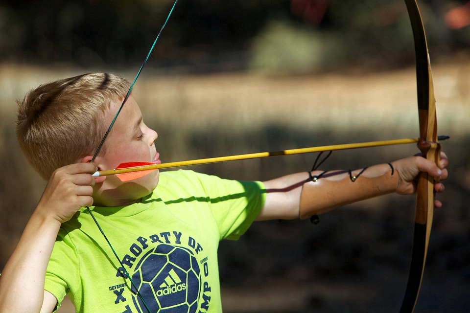 Boy bow and arrow archery photo