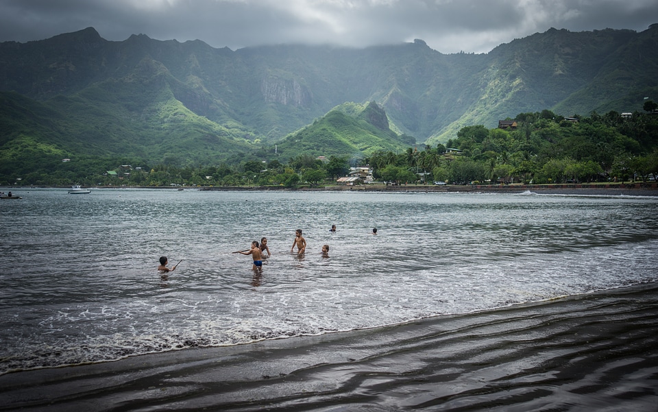 Children swimming mountains landscape