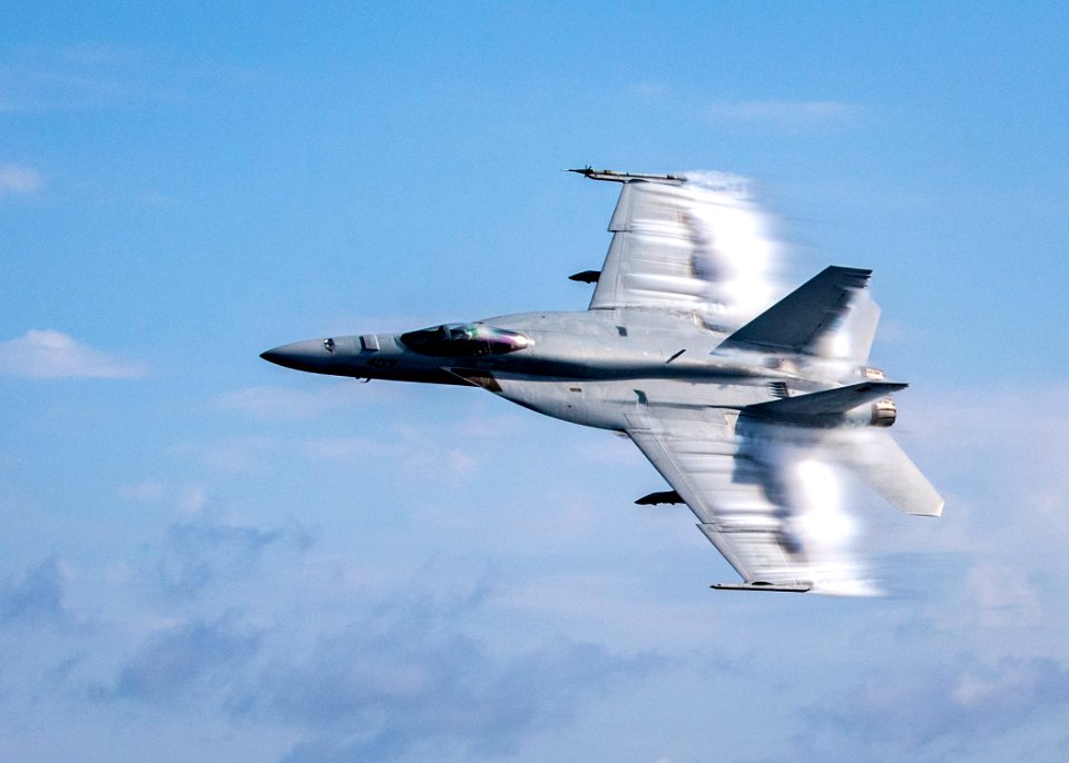 190823-N-UB406-0104 ATLANTIC OCEAN (Aug. 23, 2019) Lt. Cmdr. Benjamin Orloff, assigned to the "Blue Blasters" of Strike Fighter Squadron 34, conducts a supersonic pass in a   F/A-18E Super Hornet next to the guided-missile destroyer USS Gridley (DDG 101)