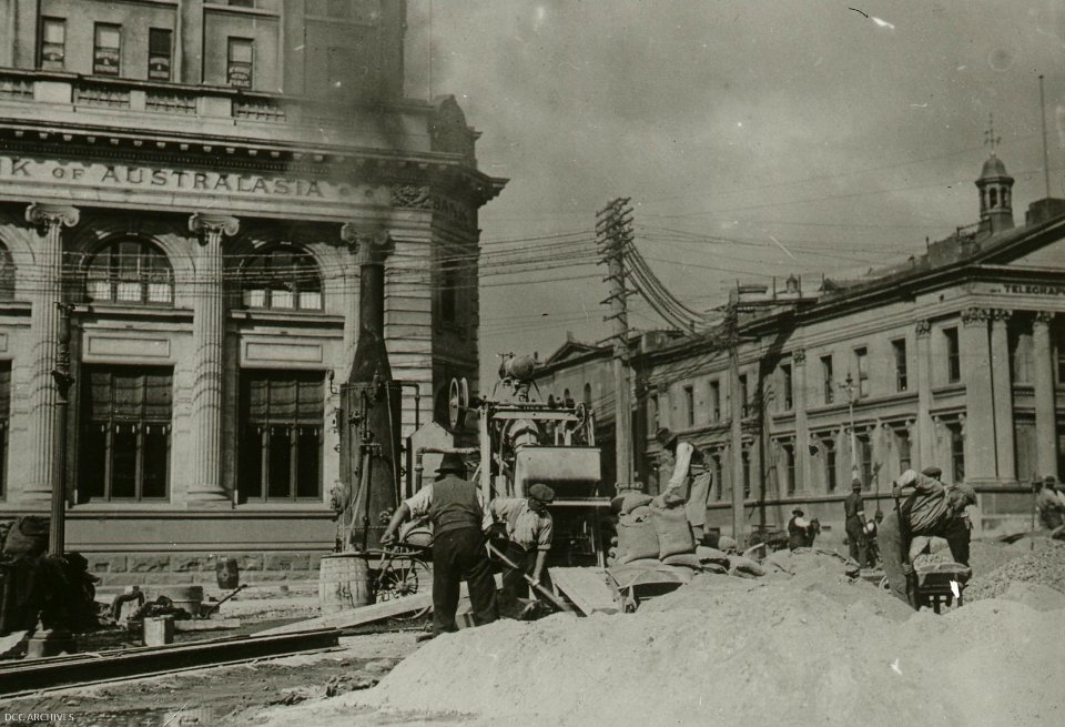 Corner of Lower Rattray Street and Bond Street - concrete mixer and men at work