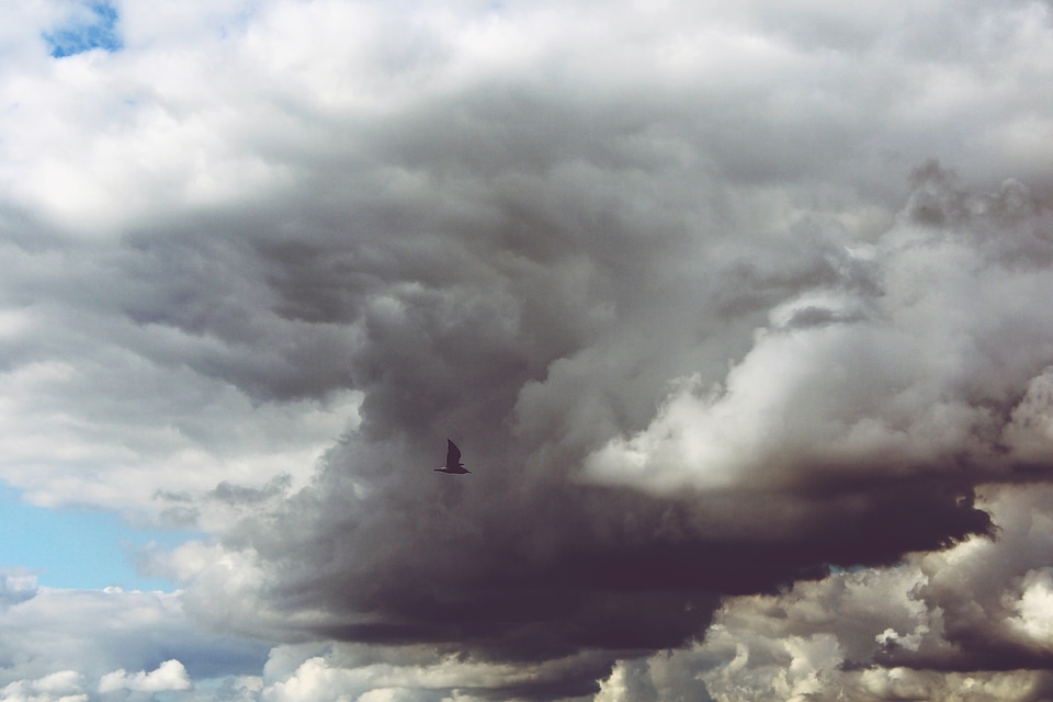 Dark clouds blue covered sky