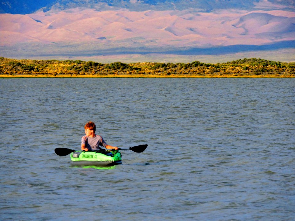Kayaker, Dunes in Background