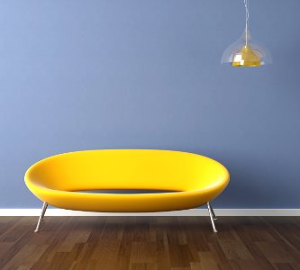 blue wall with yellow couch interior design